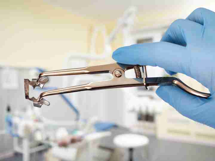 Rubber dam clamp forceps used during root canal treatment
